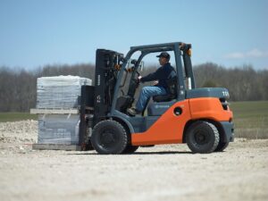 Toyota IC pneumatic tire forklift moving pallets outside