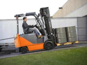 A driver uses an electric forklift in California.