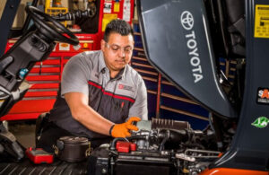 Technician performing Preventative Maintenance on Toyota forklift